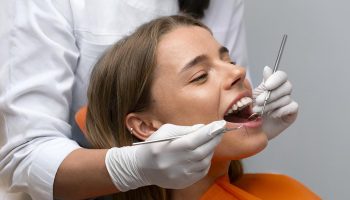 How to Treat a Black Spot on a Tooth Near the Gum?